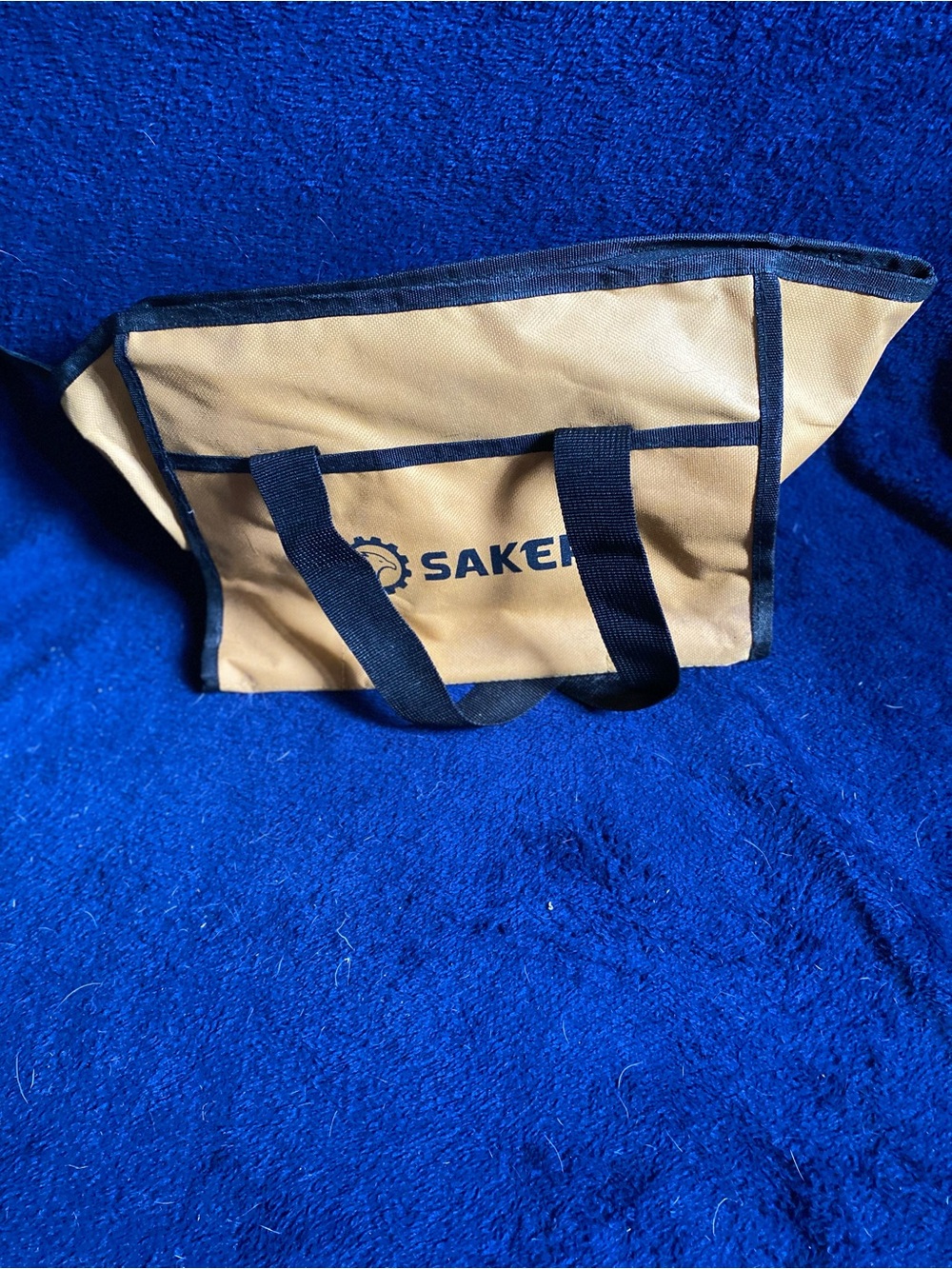 Small gold and black tool bag with safety glasses- Saker